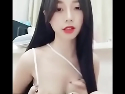 Beautiful asian chick on smartphone